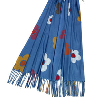 Colourful daisies on a vibrant blue scarf