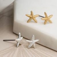 Two pairs Gold & silver starfish earrings