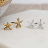 Two pairs Gold & silver starfish earrings