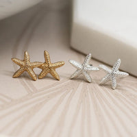 Two pairs Gold & silver starfish earrings