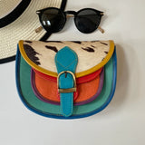 Colourful multicoloured crossbody bag with faux cow hide flap