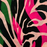 Close-up of colorful abstract pattern with pink, black, and beige colors.